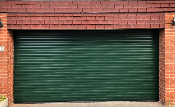green wide roller shutter garage door