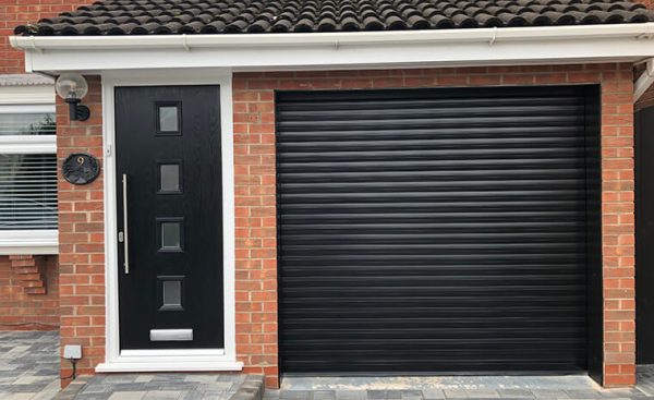 black roller garage door with matching front door
