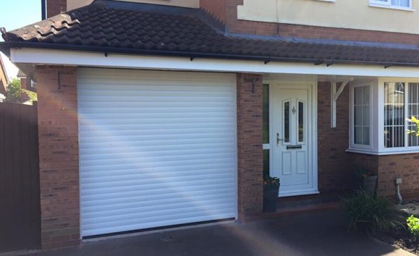 white roller garage door and front door