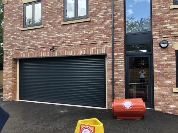 black roller shutter garage door